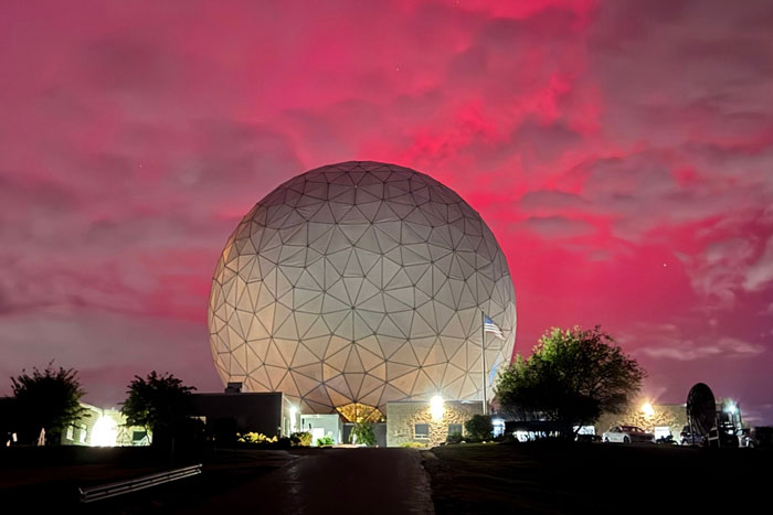 Gorgeous bright pink night sky behind the Haystack sphere