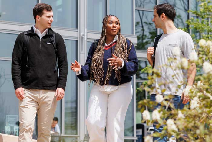 3 Sloan students walk together