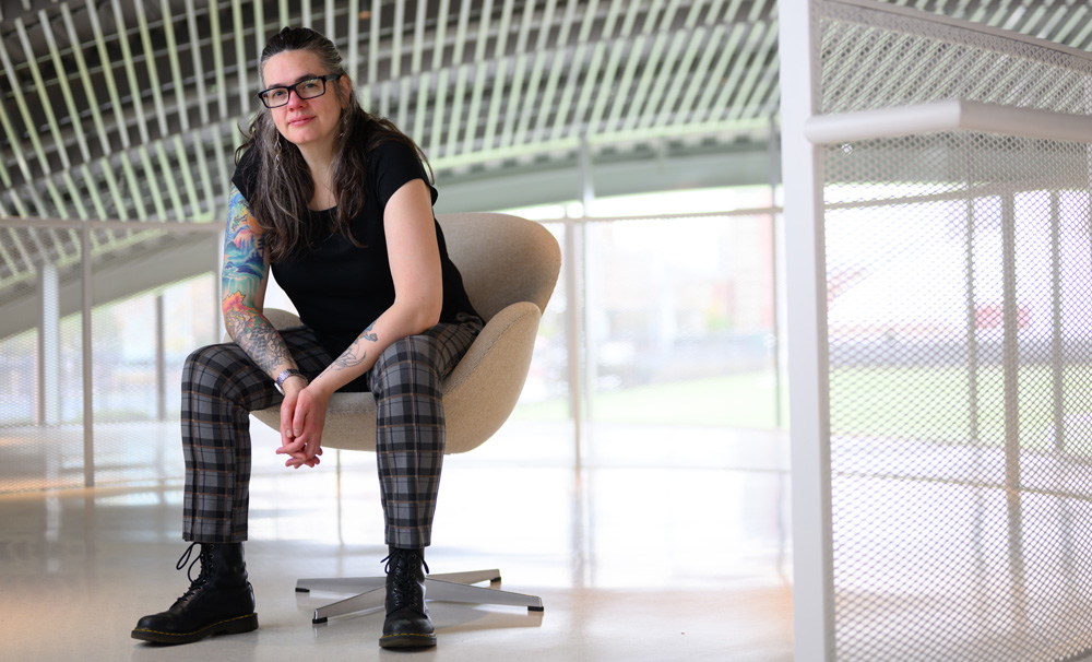 Leslie Tilley seated in large room